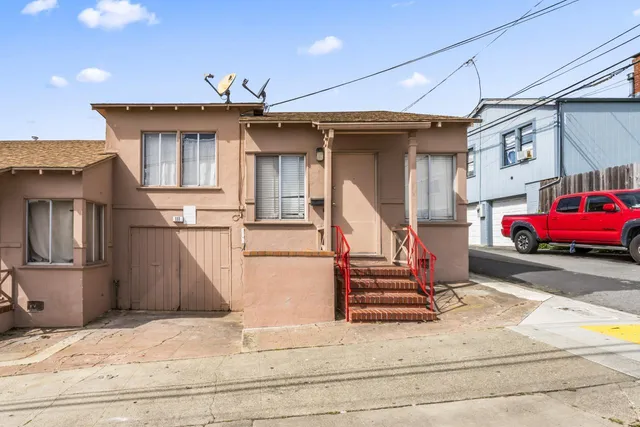 a view of a house with a street