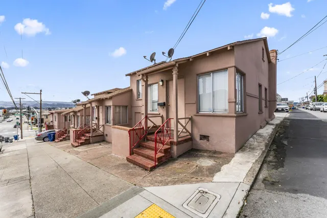 a view of multiple house with large windows