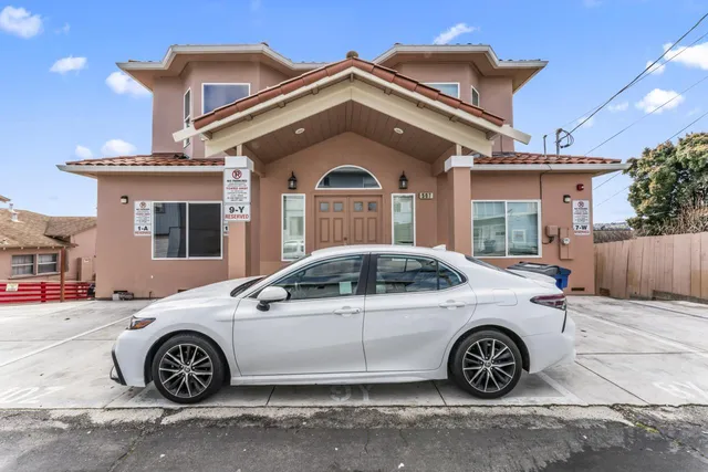 a car parked in front of a house