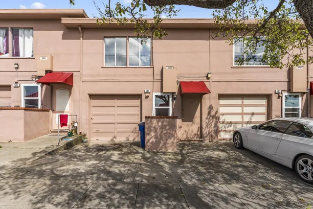 a view of a car park in front of house
