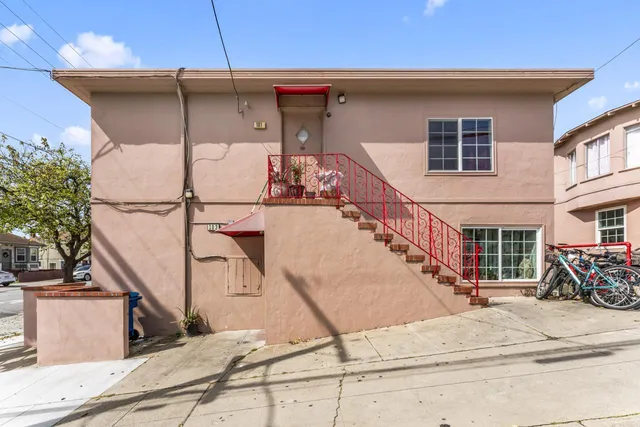 a view of a house with wooden stairs