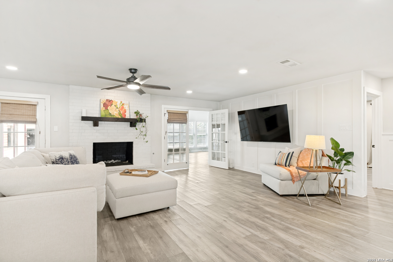 102 Silver Spring Universal City, TX 78148 - Photo 8 of 36 a living room with furniture fireplace and flat screen tv
