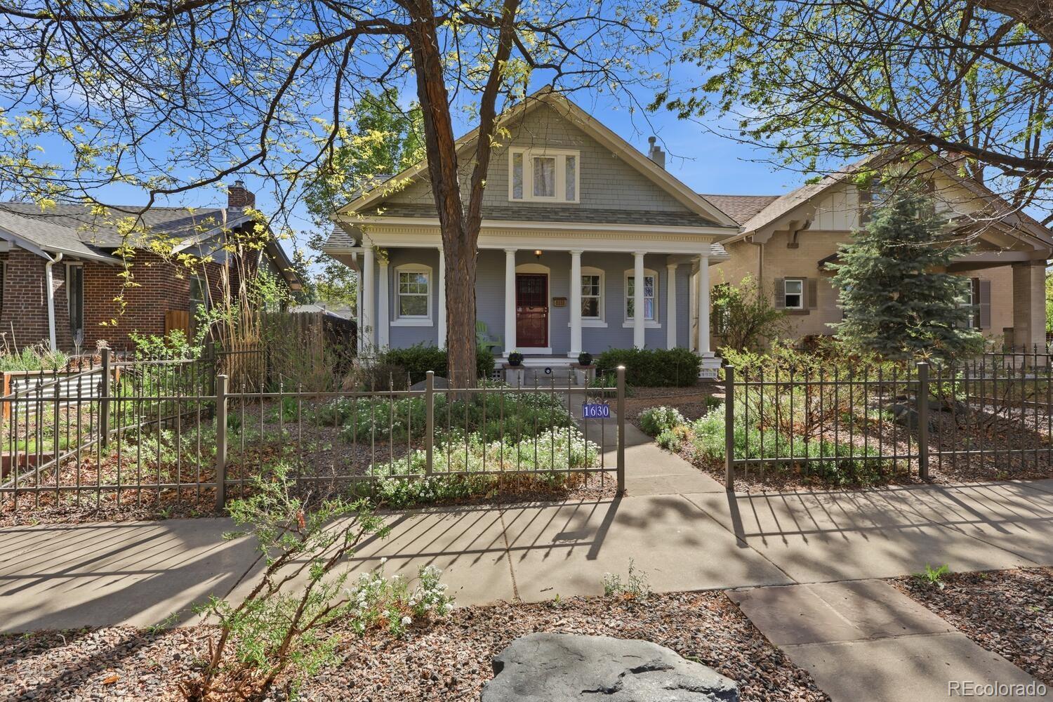 1630 Albion Street Denver, CO 80220 - Photo 1 of 28 a view of a house with a yard