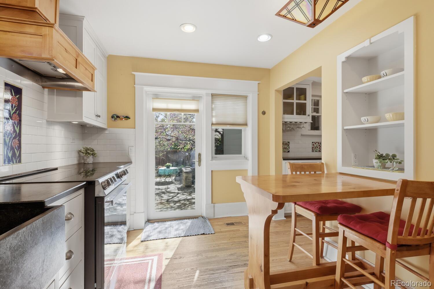 1630 Albion Street Denver, CO 80220 - Photo 14 of 28 a view of a dining room with furniture and window