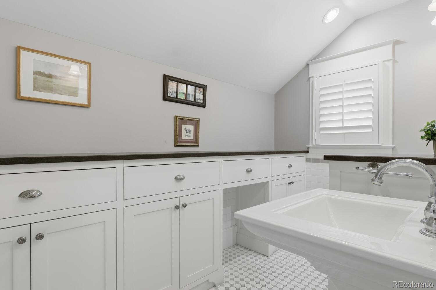 1630 Albion Street Denver, CO 80220 - Photo 20 of 28 a bathroom with a bathtub and a sink
