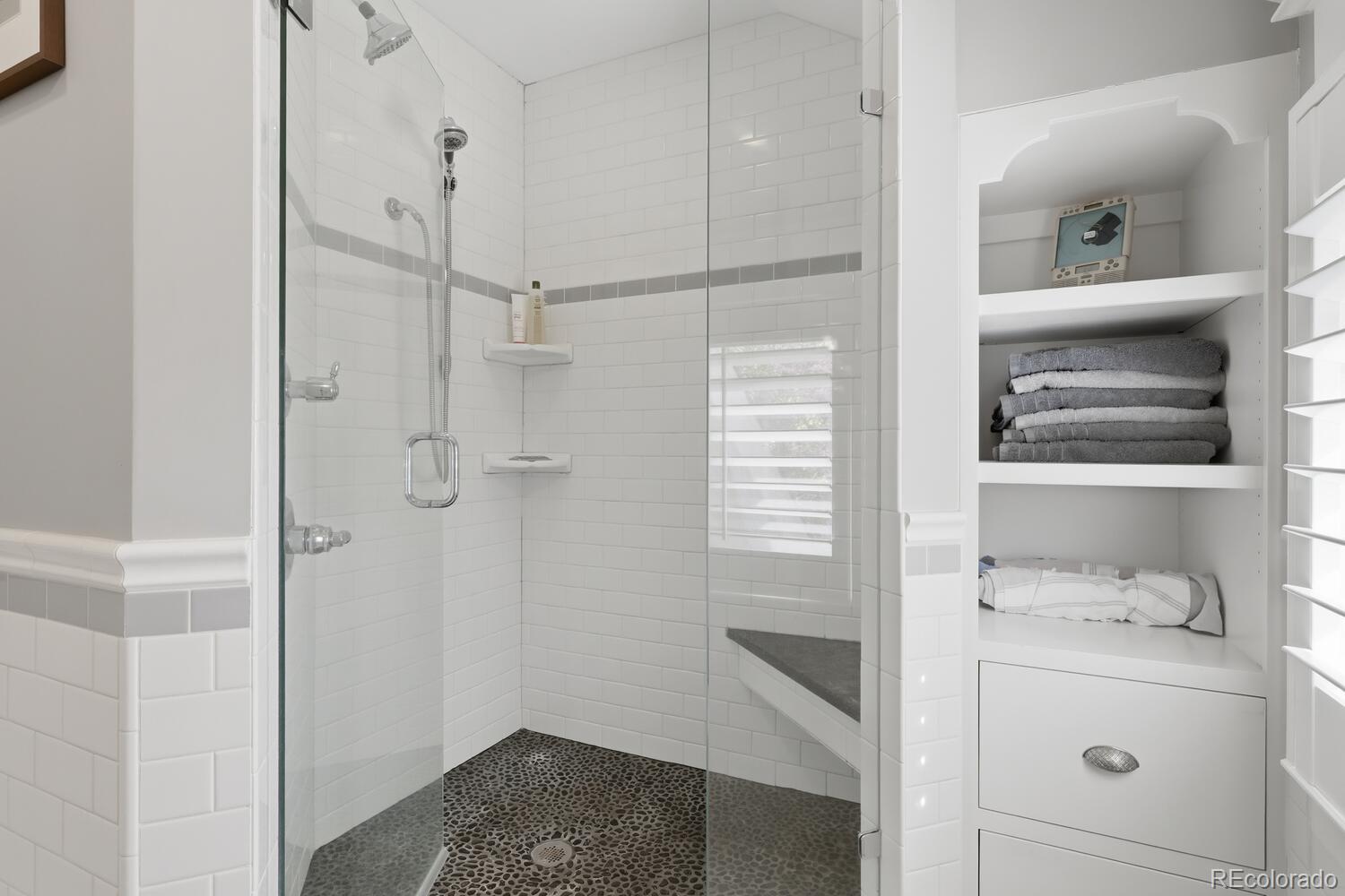1630 Albion Street Denver, CO 80220 - Photo 21 of 28 a bathroom with a sink and shower