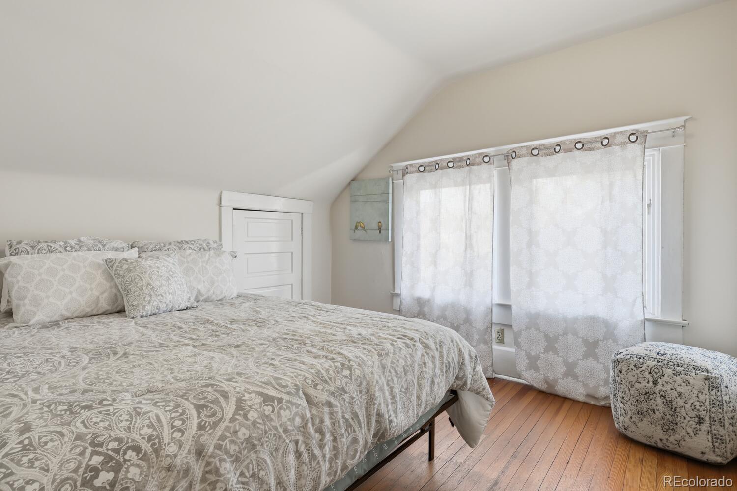 1630 Albion Street Denver, CO 80220 - Photo 22 of 28 a bedroom with a bed and a window