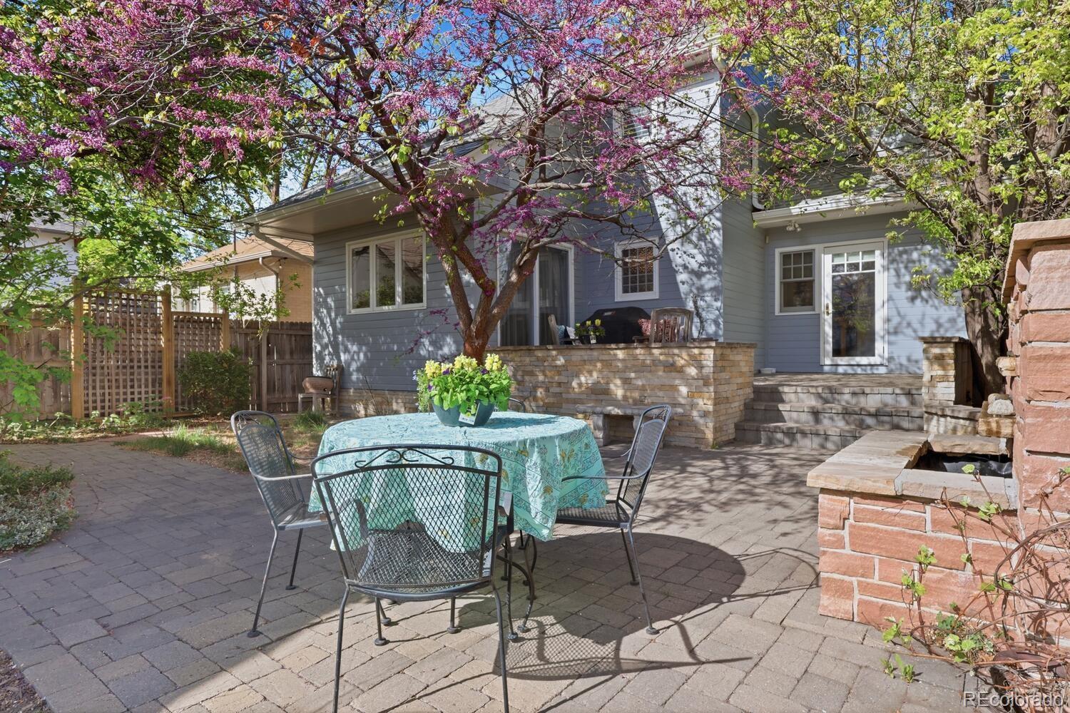 1630 Albion Street Denver, CO 80220 - Photo 27 of 28 a view of a house with backyard sitting area and garden
