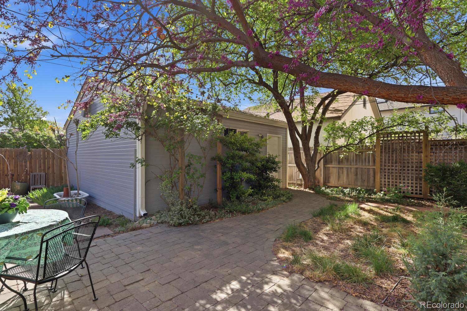 1630 Albion Street Denver, CO 80220 - Photo 28 of 28 a backyard of a house with table and chairs