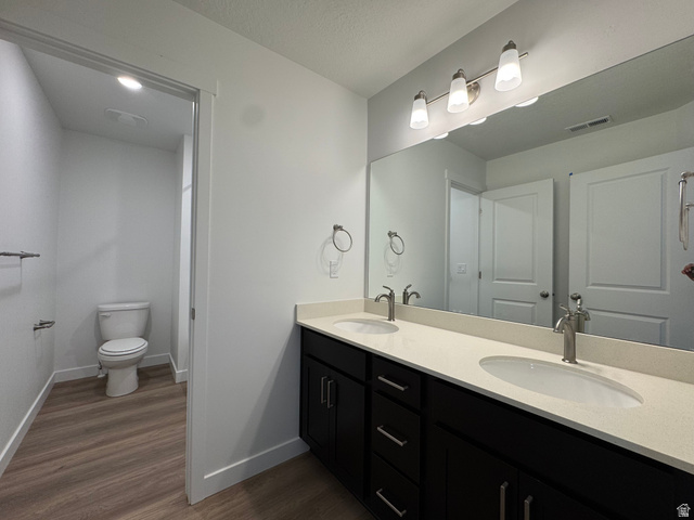 1476 North 1875 West, Unit 152 Layton, UT 84041 - Photo 18 of 20 Dual vanity featuring stone-finish countertops, undermount sinks, and brushed nickel faucets