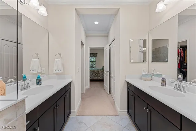 a spacious bathroom with a double vanity sink a and a mirror