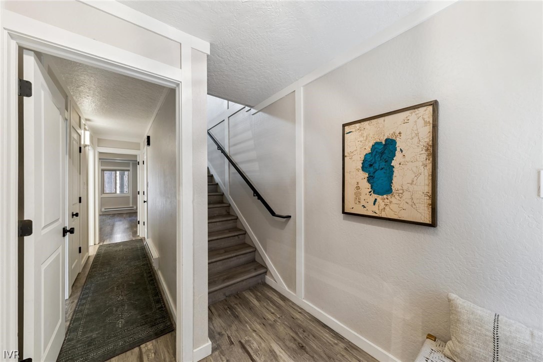 989 Tahoe Boulevard, Unit 91 Incline Village, NV 89451 - Photo 21 of 31 a view of a hallway with wooden floor and staircase