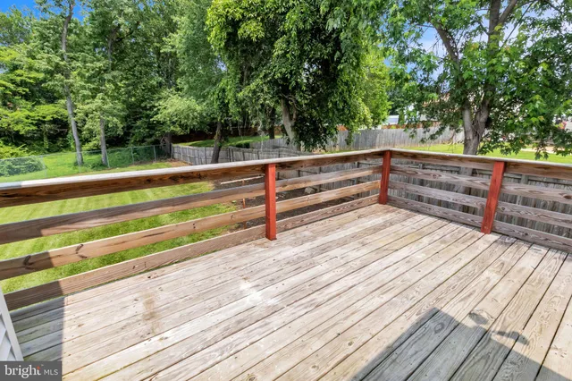 a view of outdoor space with deck and white umbrellas