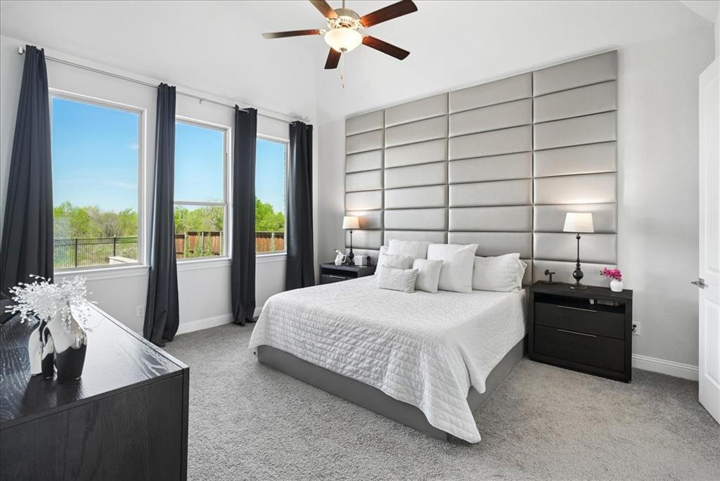 2721 Rotherham Street Prosper, TX 75078 - Photo 12 of 37 a bedroom with a bed and a large window