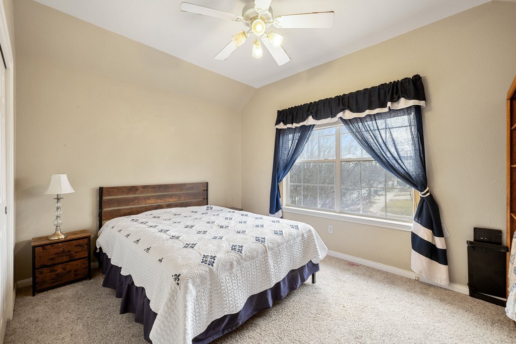 207 Rosedale Boulevard Georgetown, TX 78628 - Photo 18 of 31 a bedroom with a bed and a window