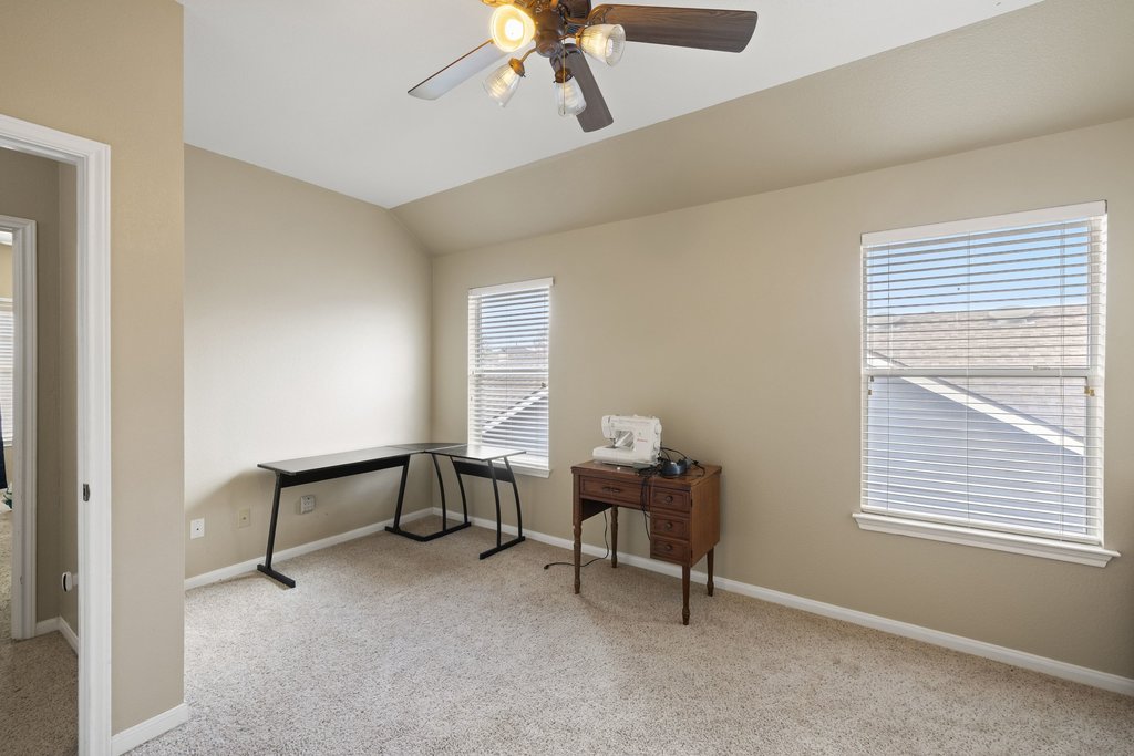 207 Rosedale Boulevard Georgetown, TX 78628 - Photo 21 of 31 a view of a workspace with furniture and a window