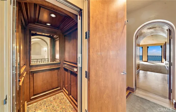 wooden floor with windows and a view of living room