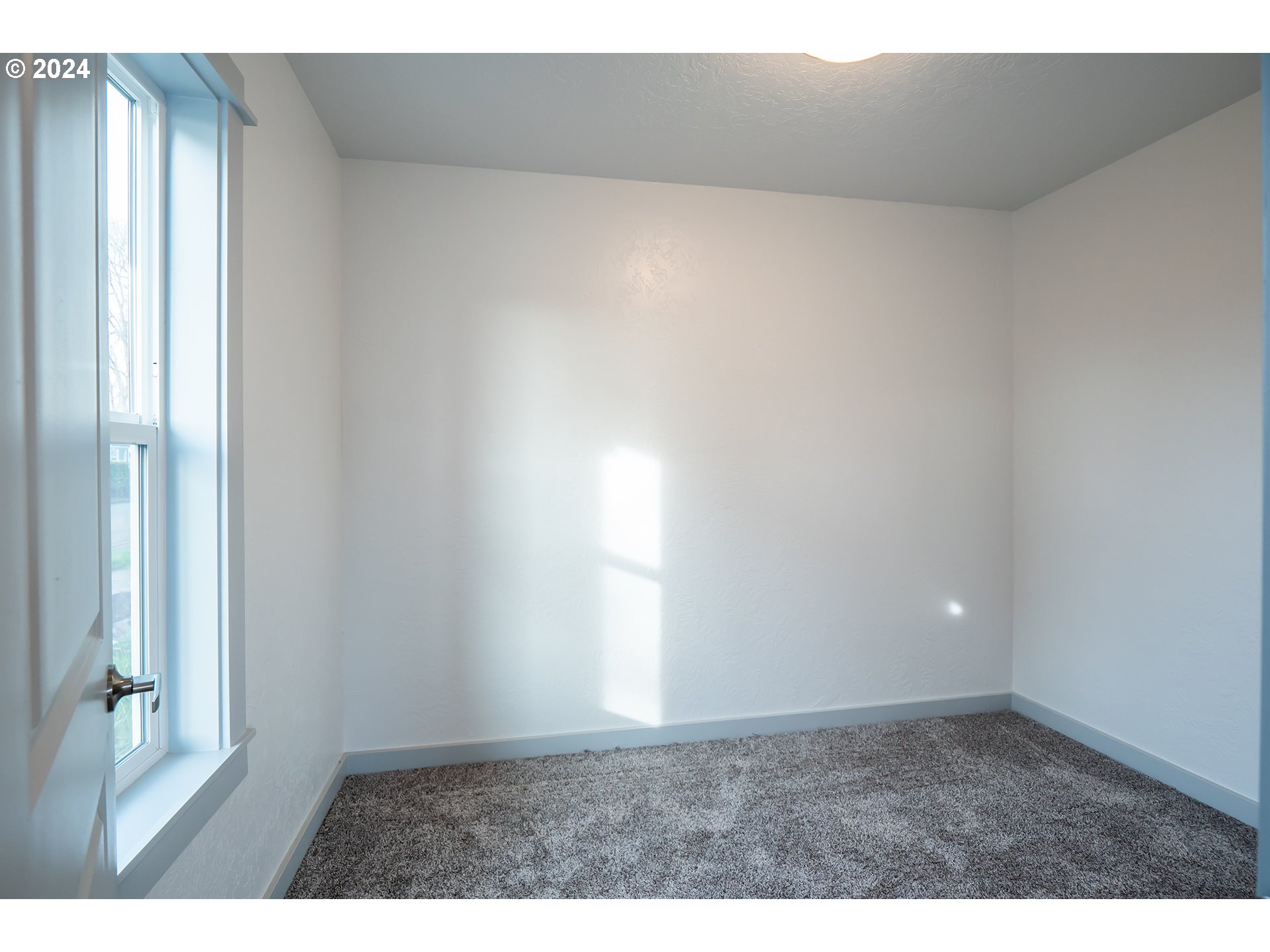 930 Elm Street Junction City, OR 97448 - Photo 14 of 33 a view of an empty room and window