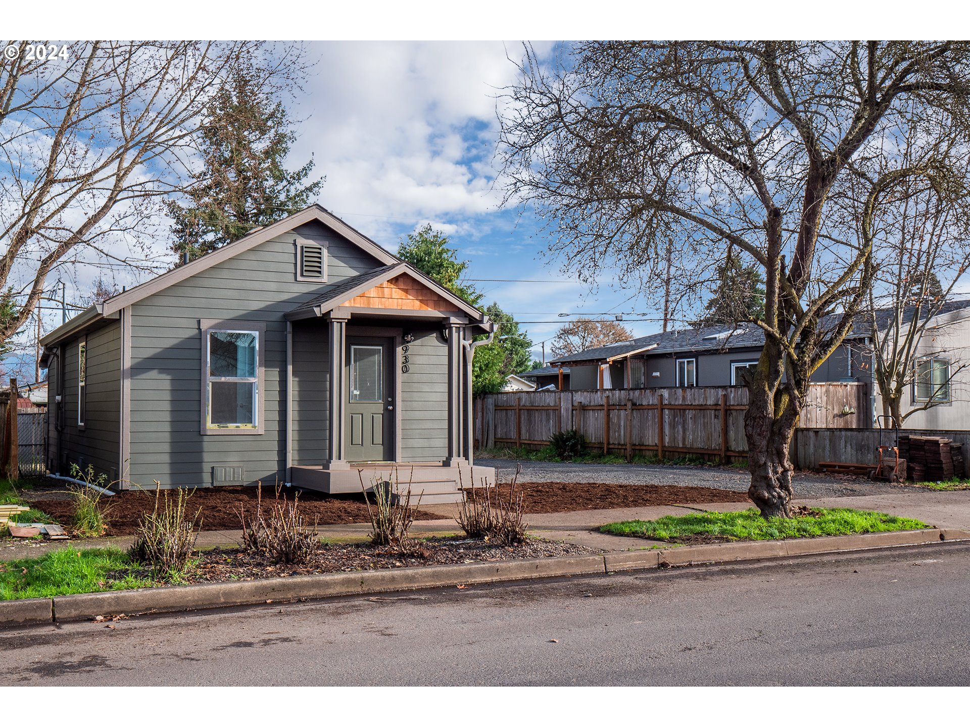930 Elm Street Junction City, OR 97448 - Photo 19 of 33 a front view of house with a yard and potted plants