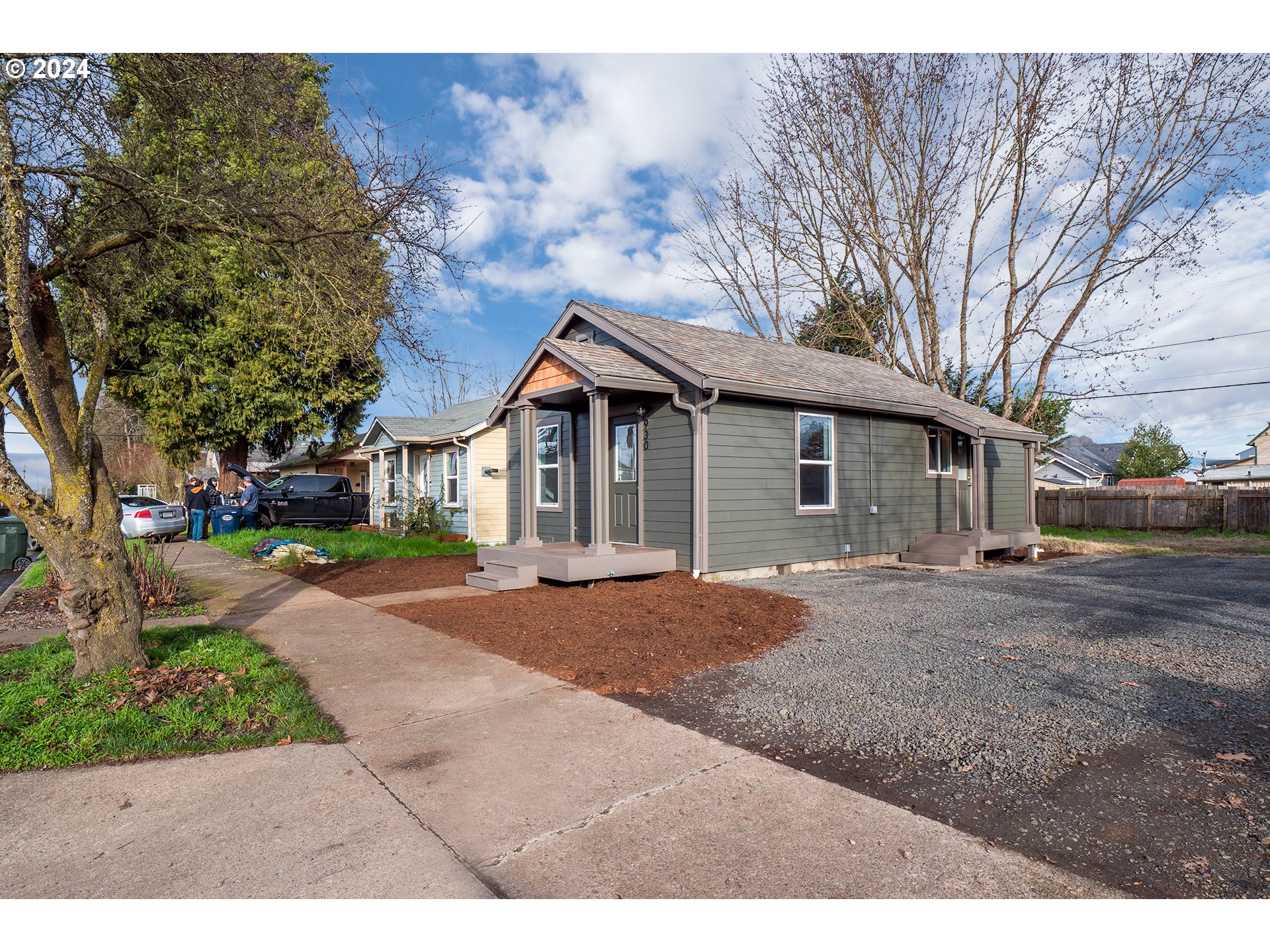 930 Elm Street Junction City, OR 97448 - Photo 20 of 33 a front view of a house with a garden