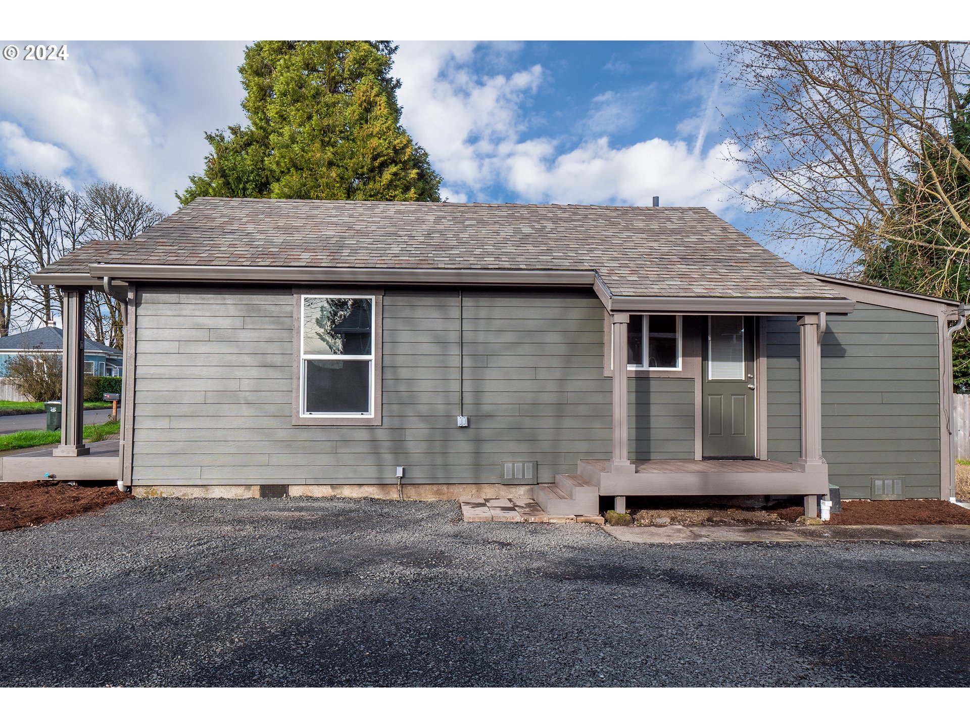 930 Elm Street Junction City, OR 97448 - Photo 22 of 33 a front view of a house with a yard