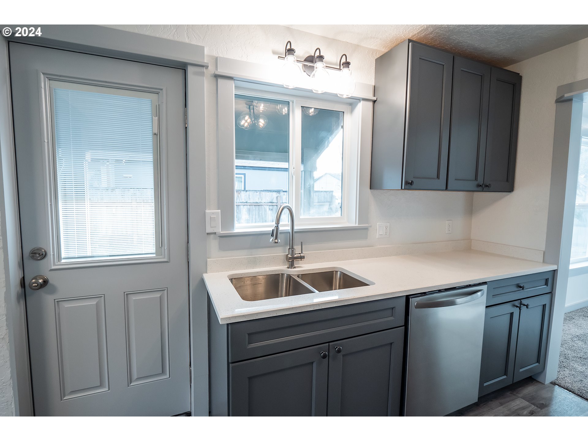 930 Elm Street Junction City, OR 97448 - Photo 5 of 33 a kitchen with a sink and cabinets