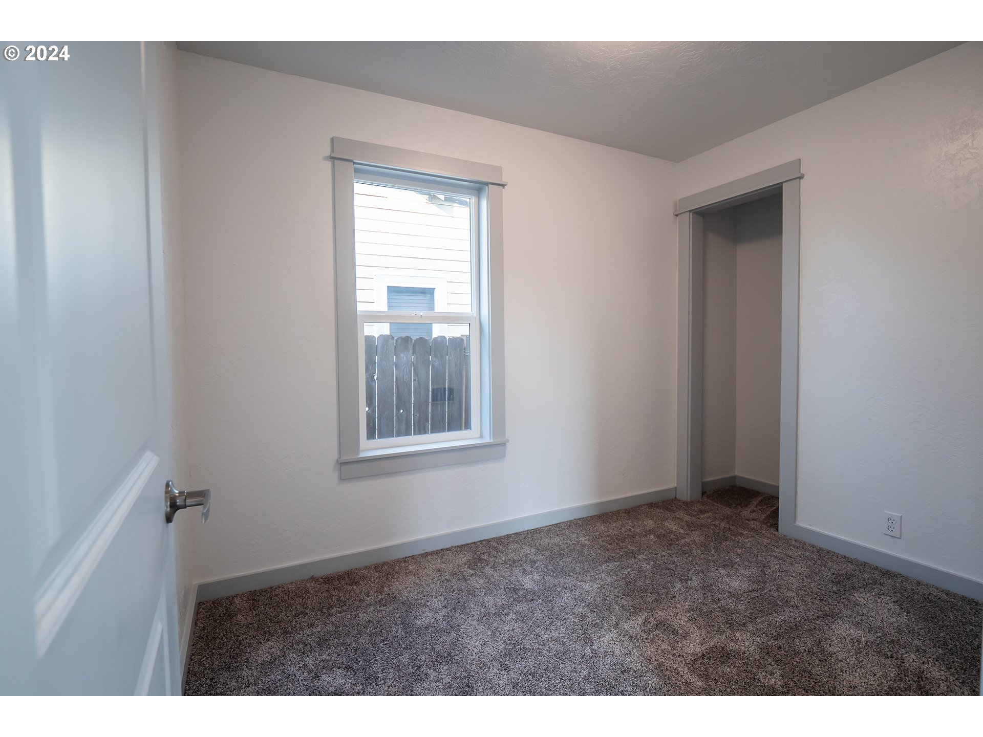 930 Elm Street Junction City, OR 97448 - Photo 9 of 33 a view of an empty room with a window