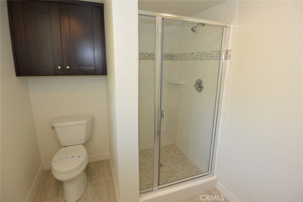 11392 Wallingsford Road Los Alamitos, CA 90720 - Photo 14 of 17 a bathroom with a toilet and a shower
