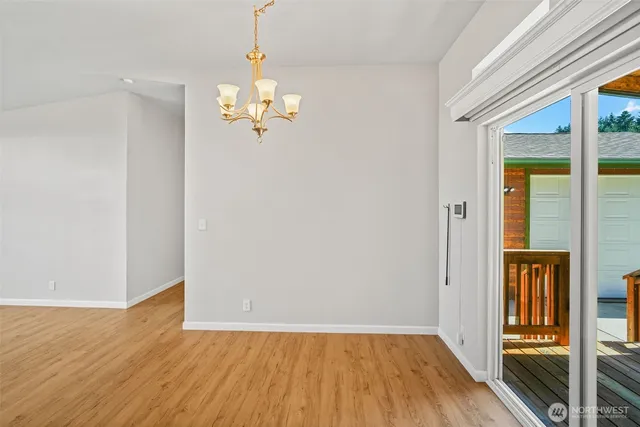 a view of kitchen with cabinets and wooden floor