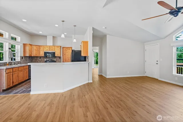 a kitchen with a refrigerator stove and sink