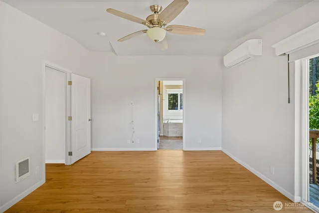 a bathroom with a granite countertop tub and a sink