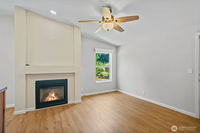 a kitchen with stainless steel appliances granite countertop a refrigerator and a stove
