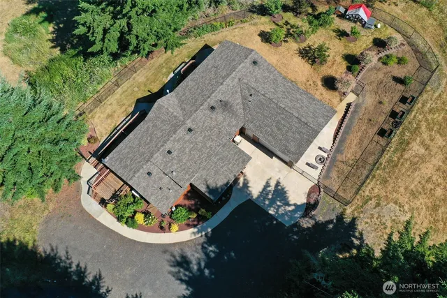 an aerial view of a house with a swimming pool