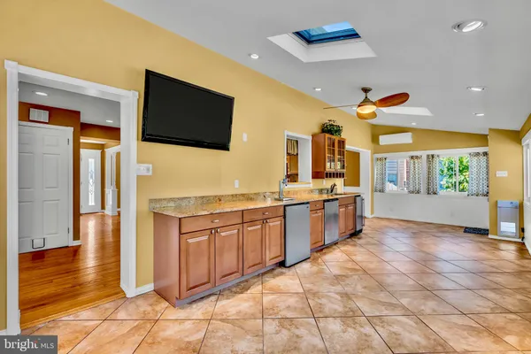 a large kitchen with stainless steel appliances lots of counter top space