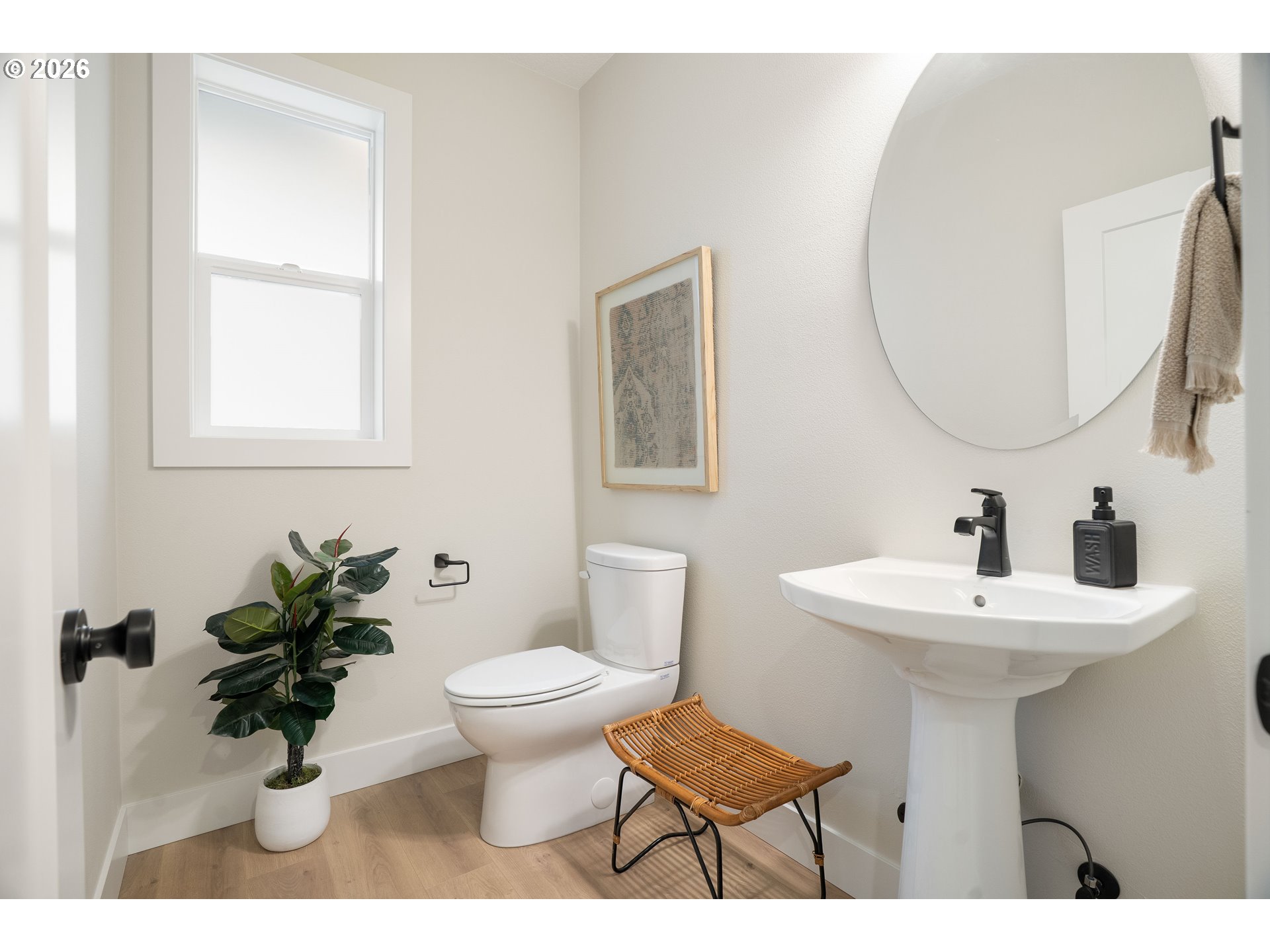 2803 Northwest 114th Terrace Portland, OR 97229 - Photo 5 of 22 a bathroom with a sink mirror and toilet