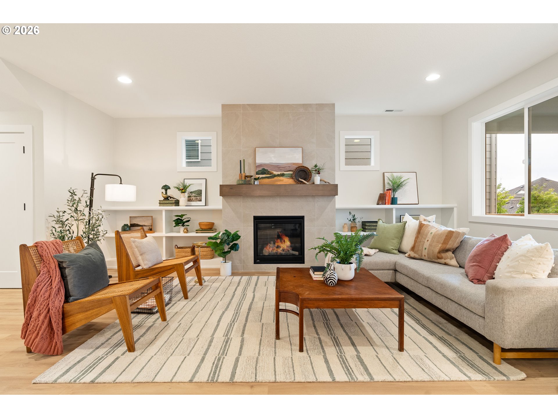 2803 Northwest 114th Terrace Portland, OR 97229 - Photo 8 of 22 a living room with furniture and a fireplace