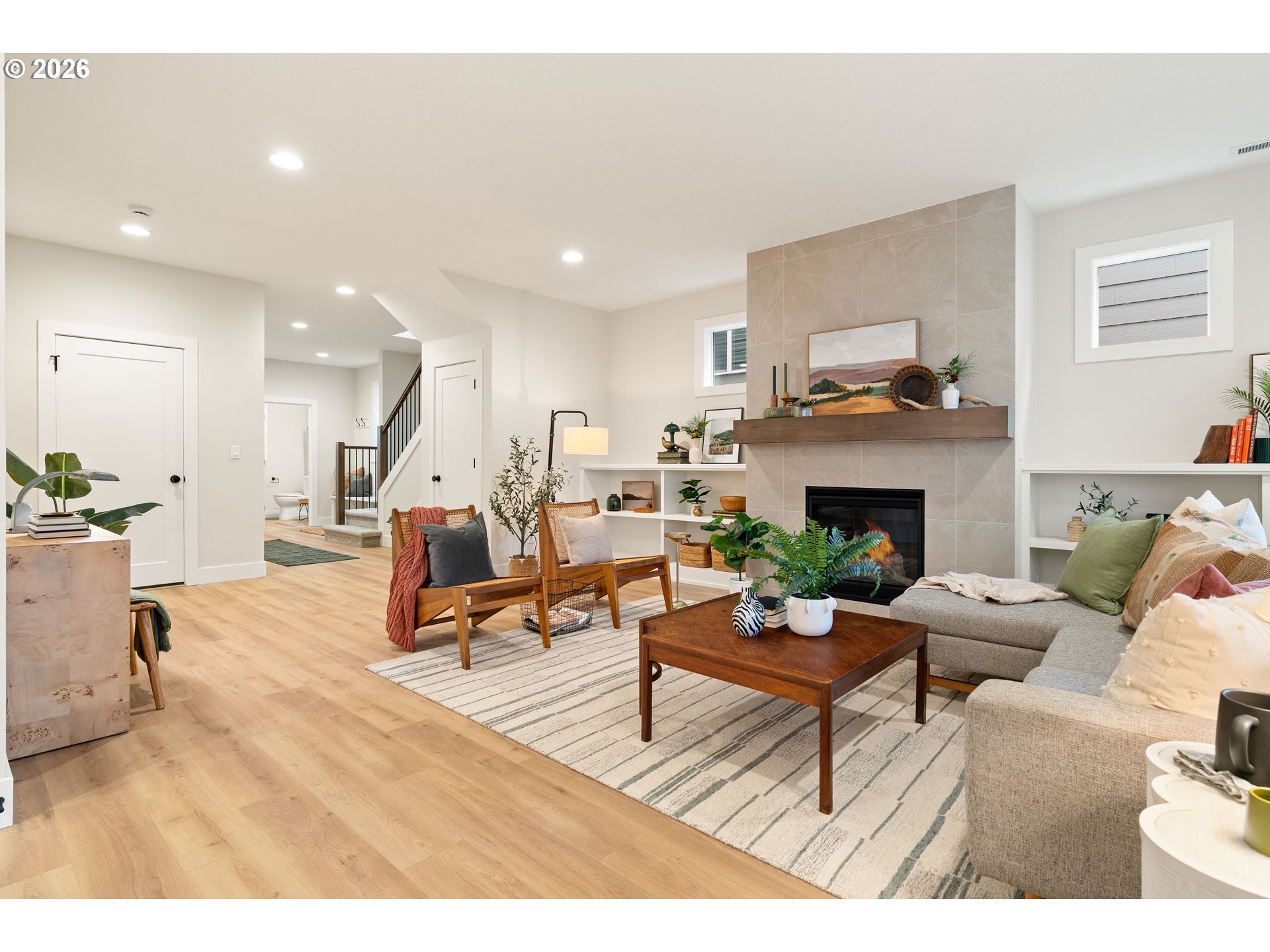 2803 Northwest 114th Terrace Portland, OR 97229 - Photo 9 of 22 a living room with furniture and a fireplace