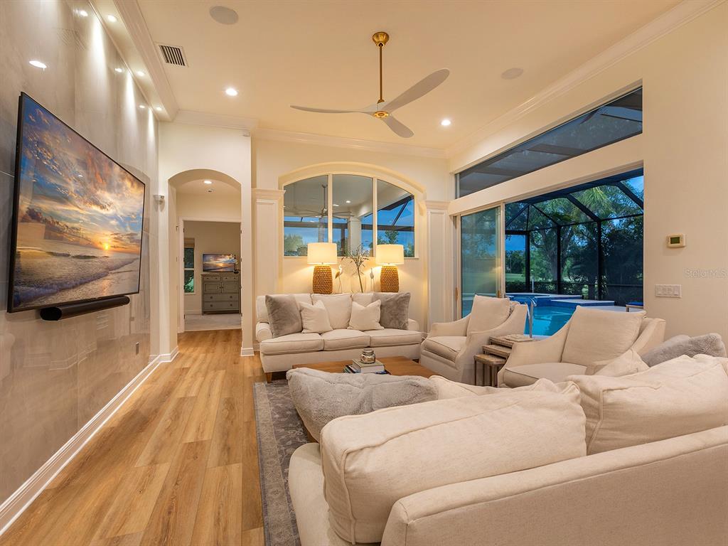 7431 Greystone Street Lakewood Ranch, FL 34202 - Photo 22 of 85 a living room with furniture and a flat screen tv