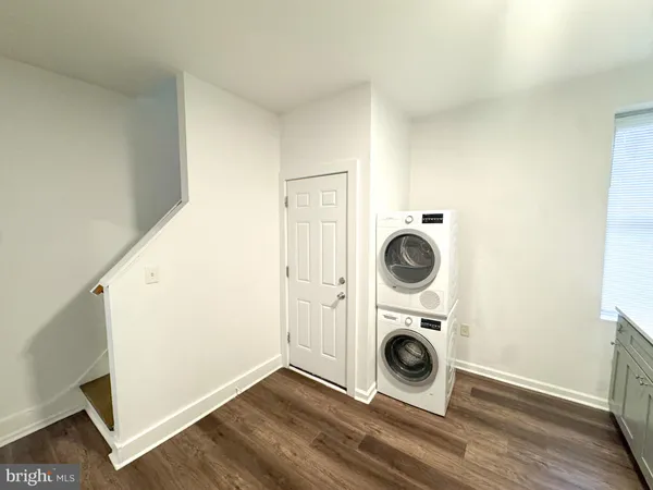 a view of a storage and utility room with washer and dryer