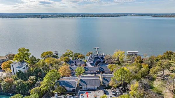 a picture of a lake with a building in the background