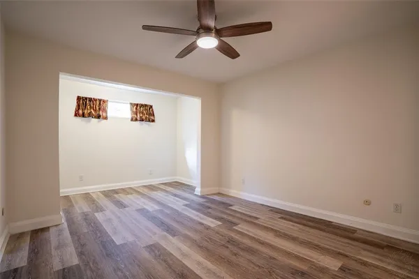 a view of an entryway with wooden floor