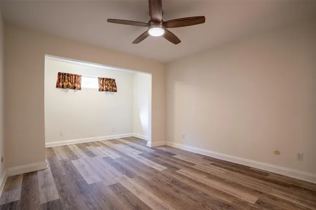 a view of an entryway with wooden floor