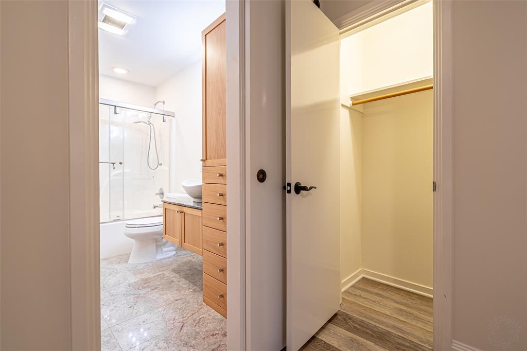 9999 Boat Club Road, Unit 207 Fort Worth, TX 76179 - Photo 23 of 32 a bathroom with a granite countertop sink mirror vanity and toilet