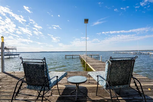 a view of an chairs and table in patio