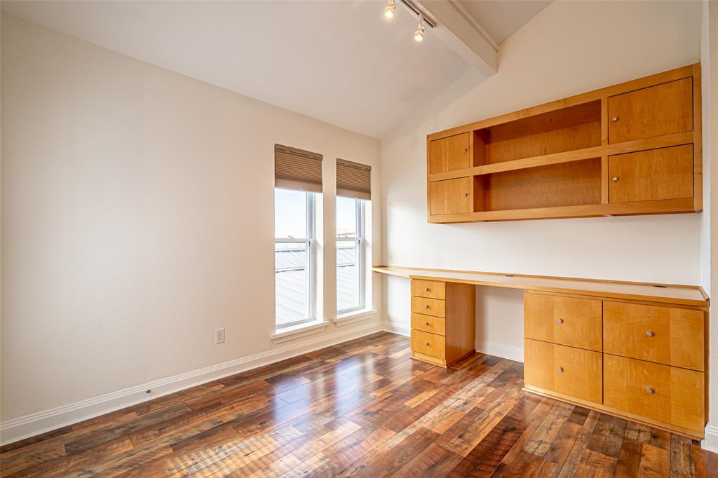 9999 Boat Club Road, Unit 207 Fort Worth, TX 76179 - Photo 10 of 32 a view of an empty room with a window and wooden floor