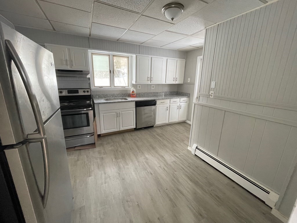 22 Rob Roy Road Worcester, MA 01602 - Photo 3 of 27 a kitchen with a sink stainless steel appliances and cabinets