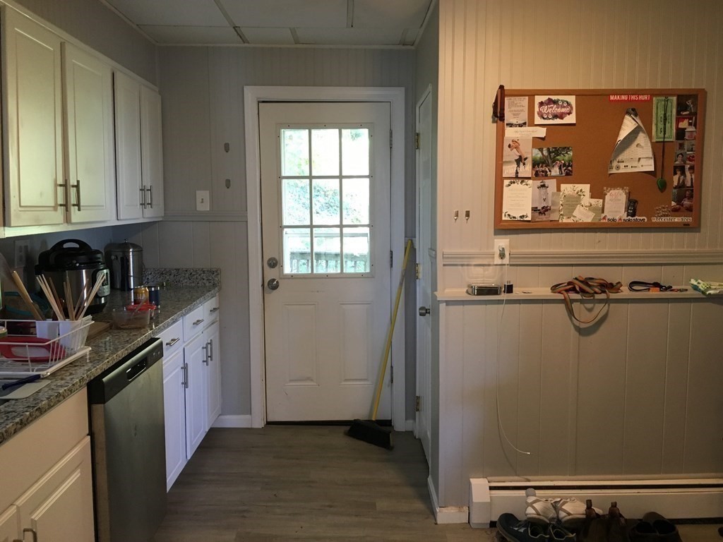 22 Rob Roy Road Worcester, MA 01602 - Photo 5 of 27 a kitchen with a refrigerator and a stove