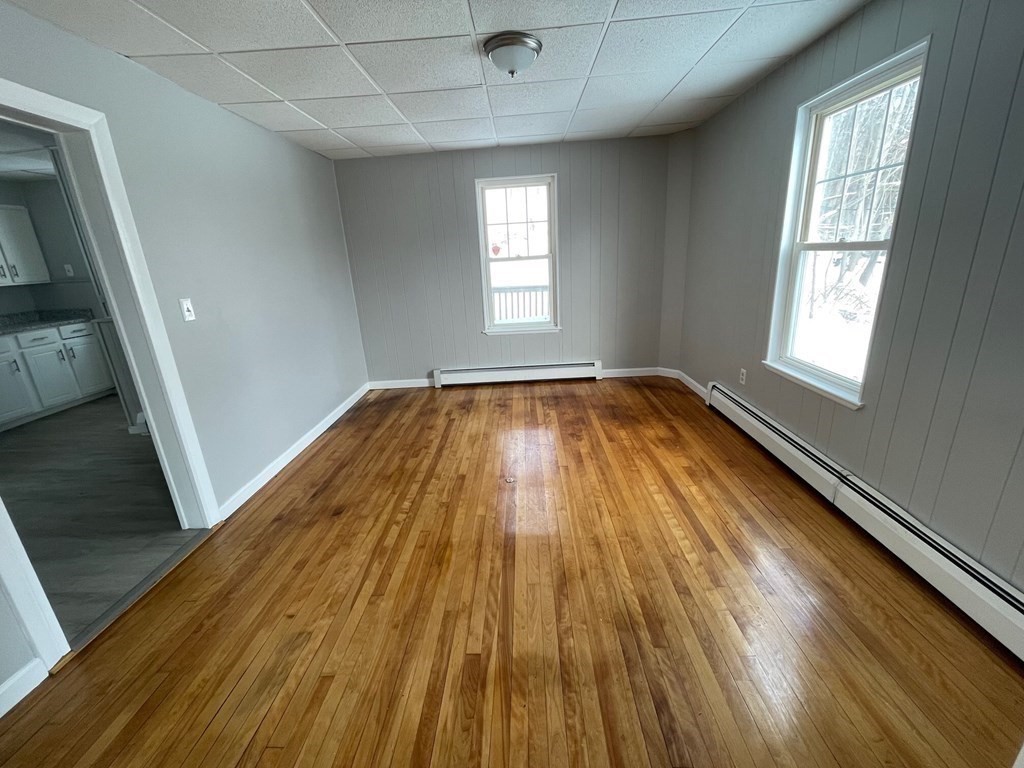 22 Rob Roy Road Worcester, MA 01602 - Photo 8 of 27 a view of empty room with wooden floor and fan