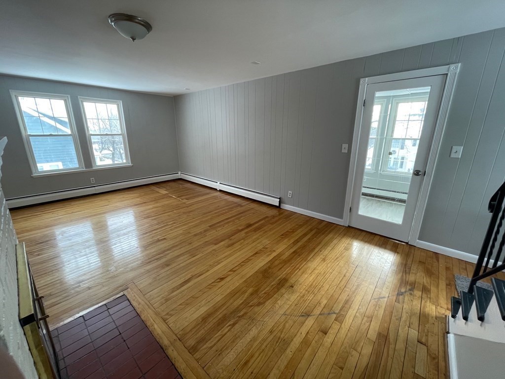 22 Rob Roy Road Worcester, MA 01602 - Photo 10 of 27 wooden floor in an empty room with a window