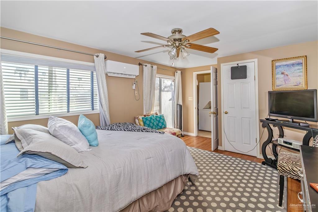 2800 Turner Road San Benito, TX 78586 - Photo 11 of 18 a bedroom with a bed and a flat screen tv